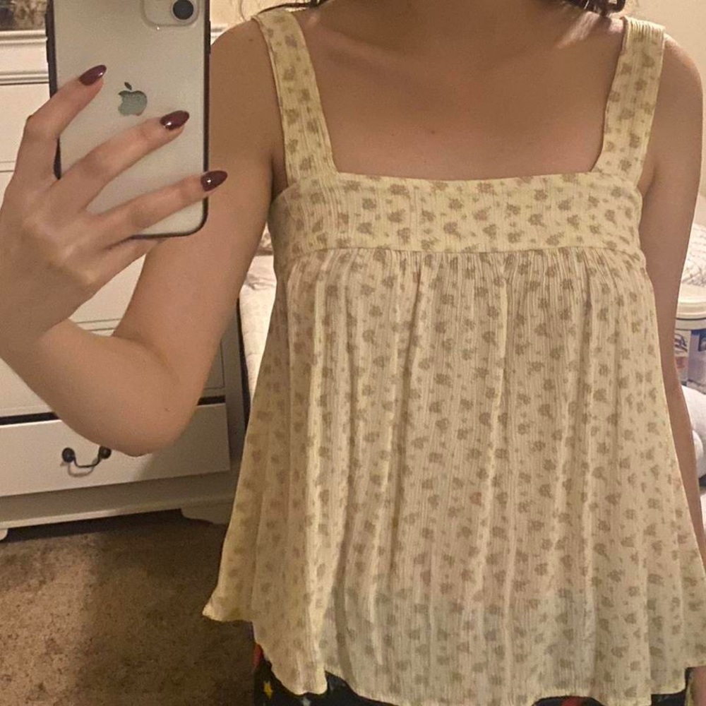 Pastel yellow flowy blouse. Size small, New with tags